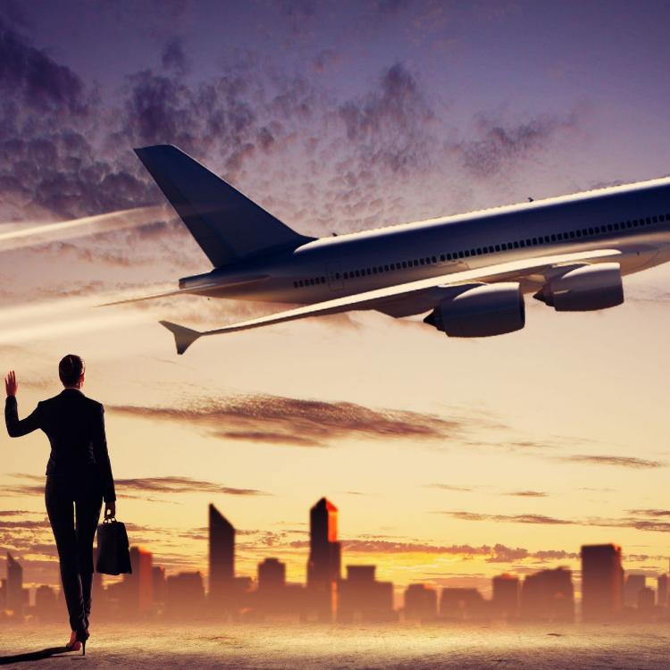 18747161 - image of business woman holding suitcase looking at airplane in sky