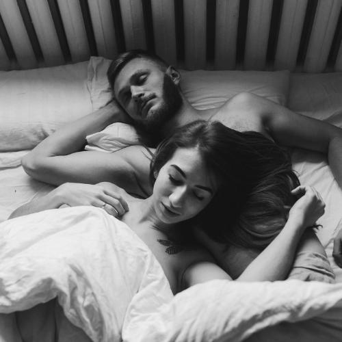 48424728 - beautiful couple lying together on the bed