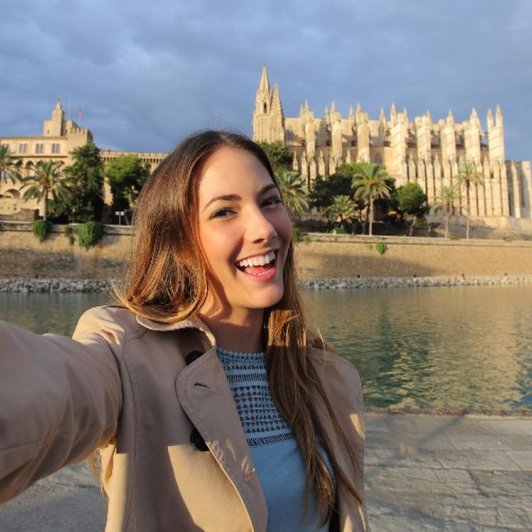 Woman photographing a selfie in Palma de Mallorca Cathedral