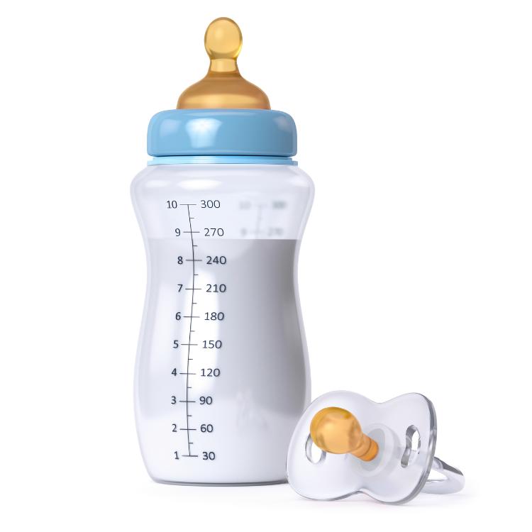 baby bottle with milk and pacifier isolated