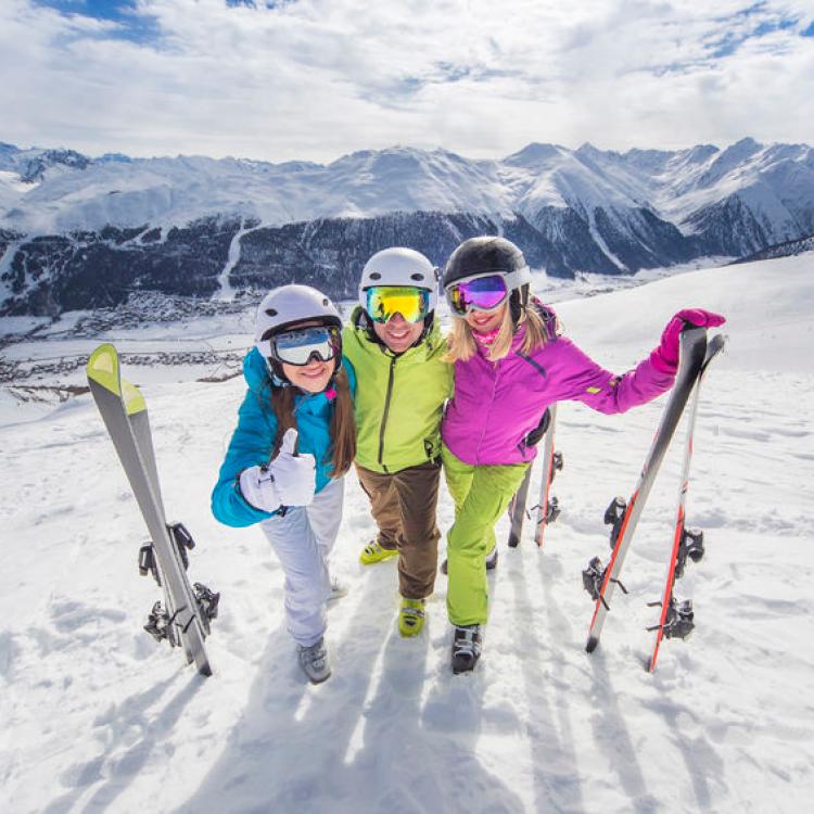 48360402 - female and male young people having skiing and snowboarding vacation on a snow slopes